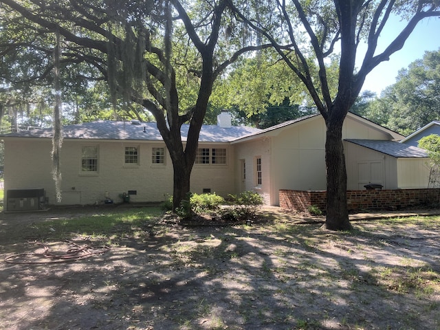874 Evans Rd, Charleston, SC 29412 - back of property with a chimney and brick siding