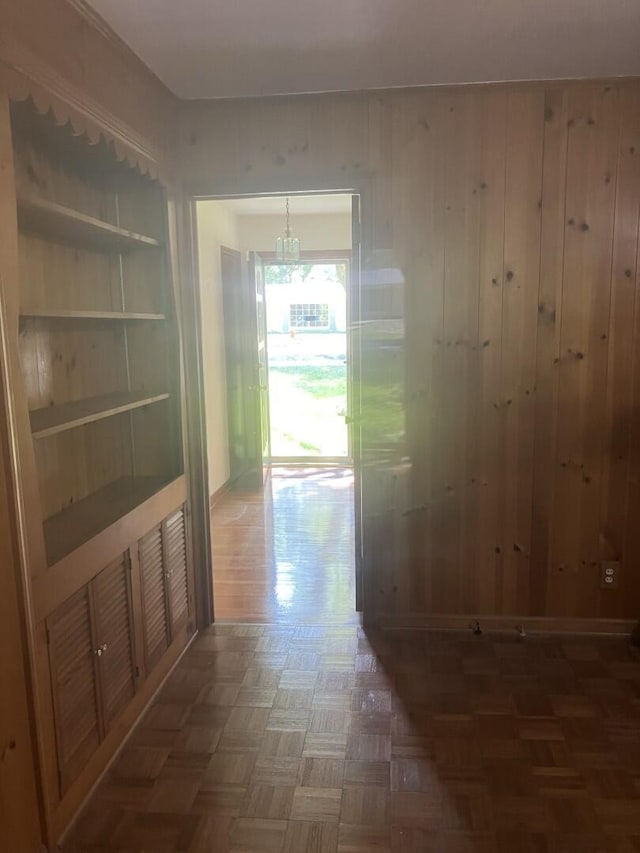 874 Evans Rd, Charleston, SC 29412 - corridor with a chandelier and wooden walls