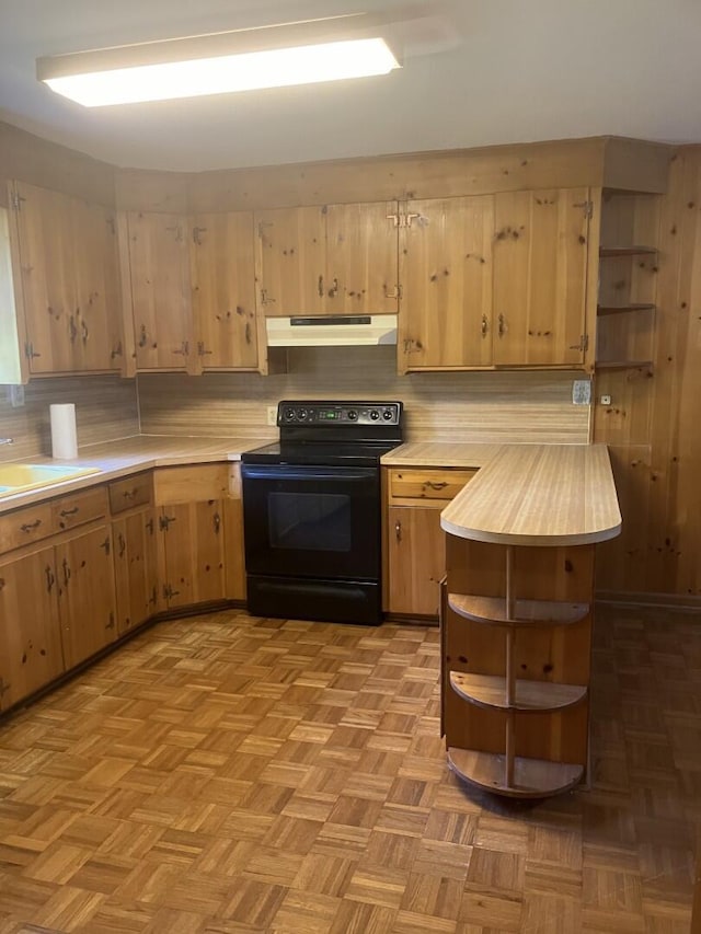 874 Evans Rd, Charleston, SC 29412 - kitchen with electric range, under cabinet range hood, light countertops, open shelves, and tasteful backsplash