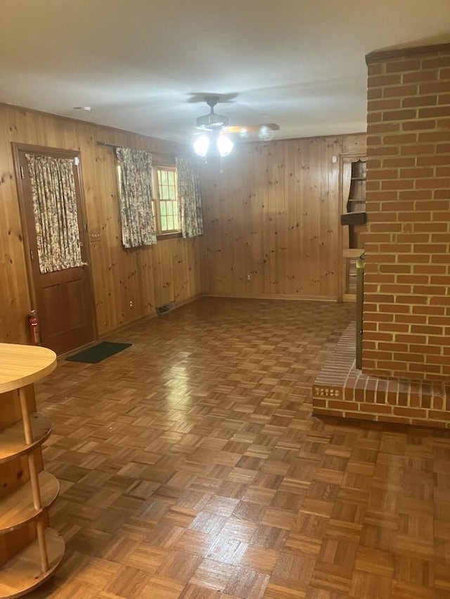 874 Evans Rd, Charleston, SC 29412 - unfurnished living room featuring ceiling fan and wood walls