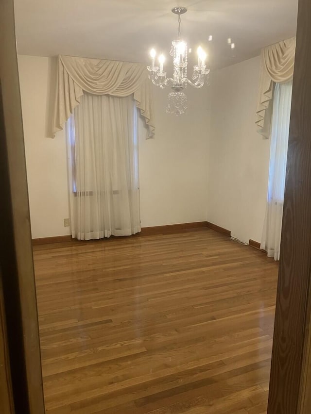 874 Evans Rd, Charleston, SC 29412 - spare room with a chandelier and wood finished floors