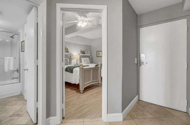 tiled foyer with ceiling fan