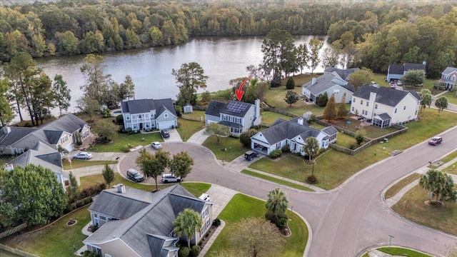 birds eye view of property with a water view