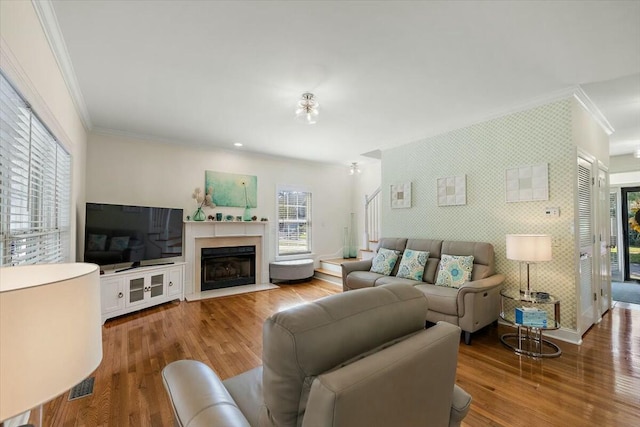 living room featuring ornamental molding and hardwood / wood-style flooring