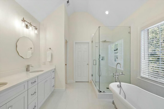 bathroom with vanity, vaulted ceiling, and shower with separate bathtub