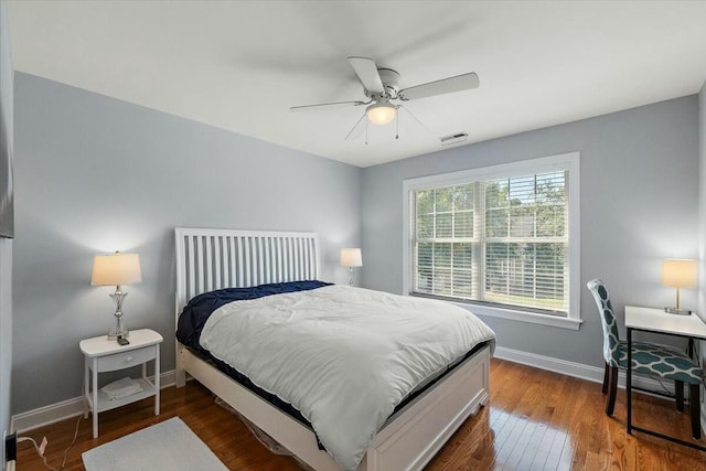 bedroom featuring ceiling fan and dark wood-type flooring