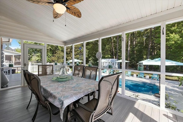 sunroom / solarium featuring ceiling fan and lofted ceiling