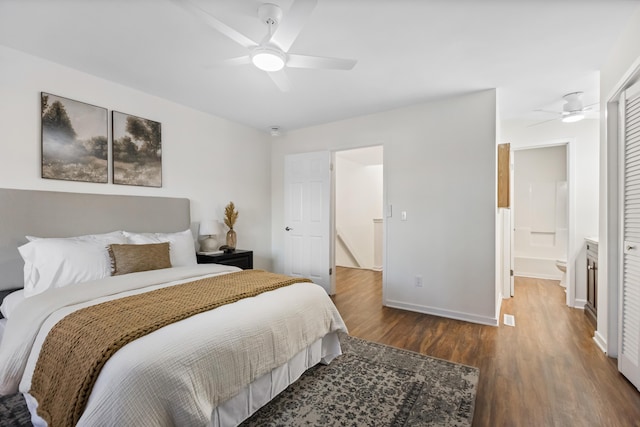 bedroom featuring a closet, hardwood / wood-style flooring, ensuite bath, and ceiling fan