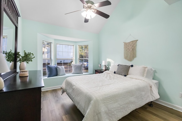 bedroom featuring hardwood / wood-style floors, ceiling fan, and lofted ceiling