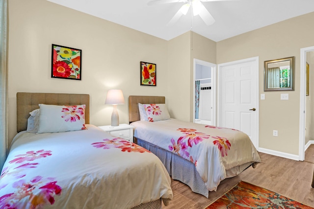 bedroom with wood-type flooring and ceiling fan