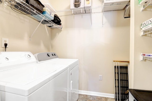 washroom featuring washer and clothes dryer