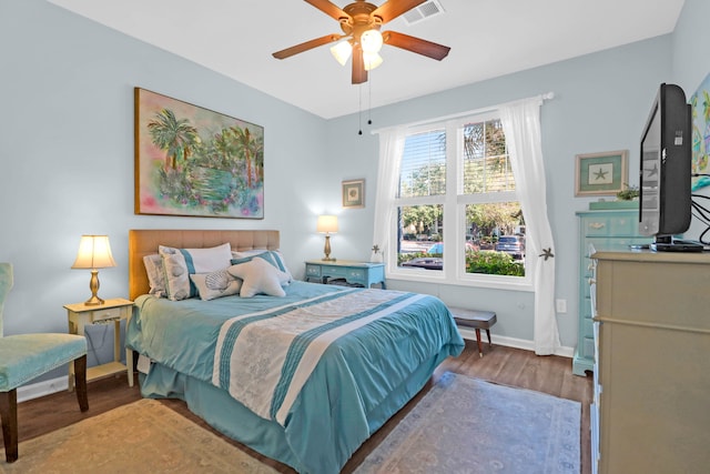 bedroom with wood-type flooring and ceiling fan