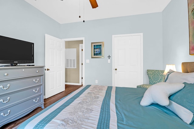 bedroom with ceiling fan and dark hardwood / wood-style flooring