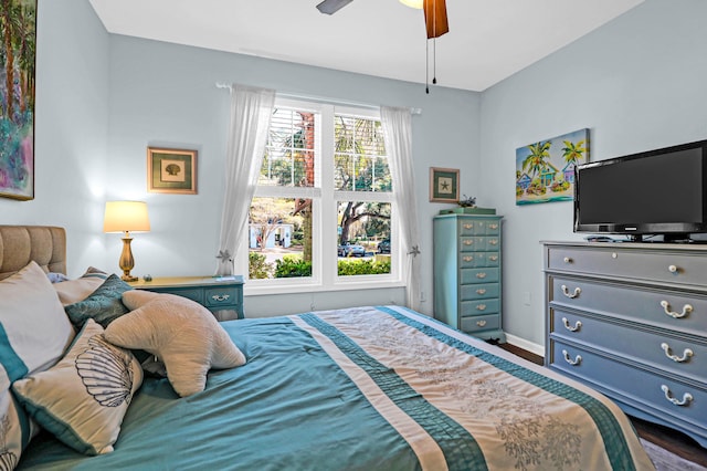 bedroom with ceiling fan and hardwood / wood-style floors