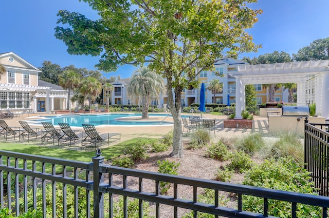 view of swimming pool with a patio and a pergola