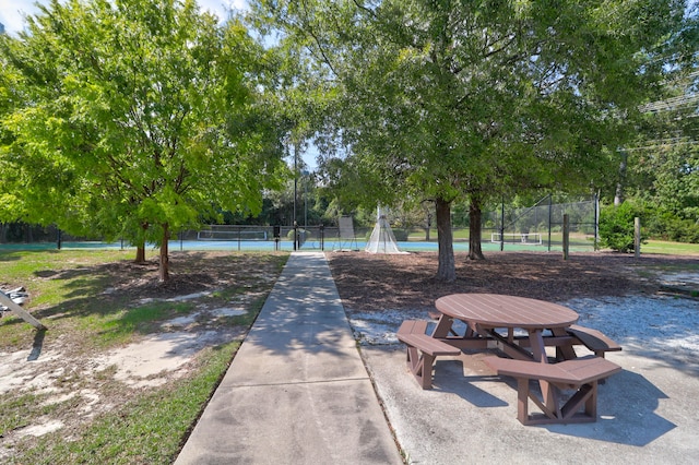 view of community with tennis court