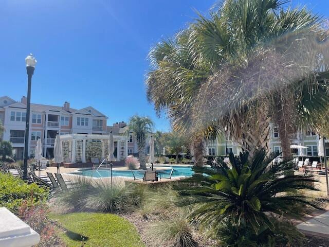 view of swimming pool with a patio area