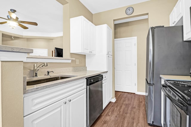 kitchen featuring white cabinetry, dark hardwood / wood-style flooring, stainless steel dishwasher, and stove