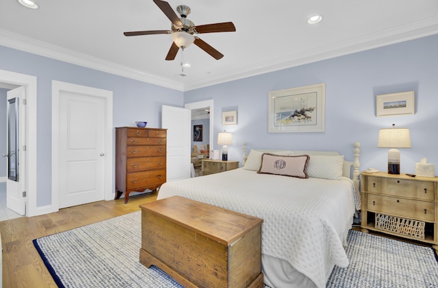 bedroom with ceiling fan, light hardwood / wood-style flooring, and crown molding