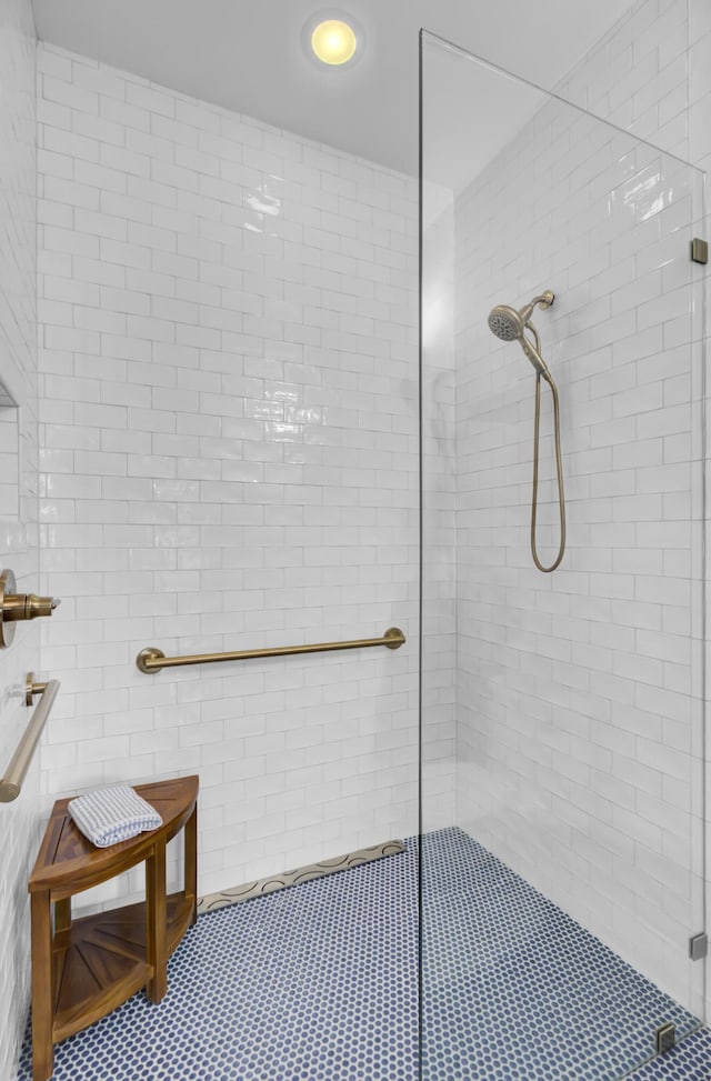 bathroom with a shower with shower door