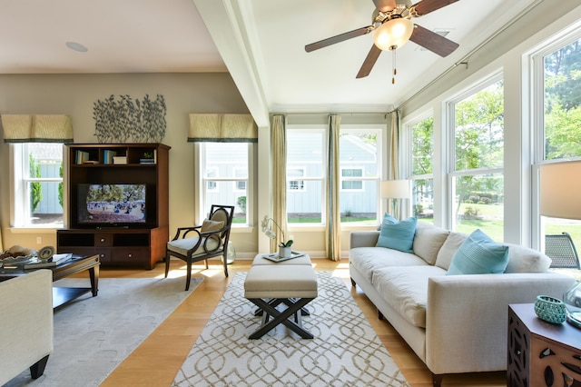 sunroom / solarium with ceiling fan