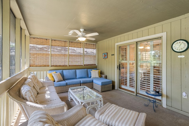 sunroom featuring ceiling fan and an outdoor hangout area