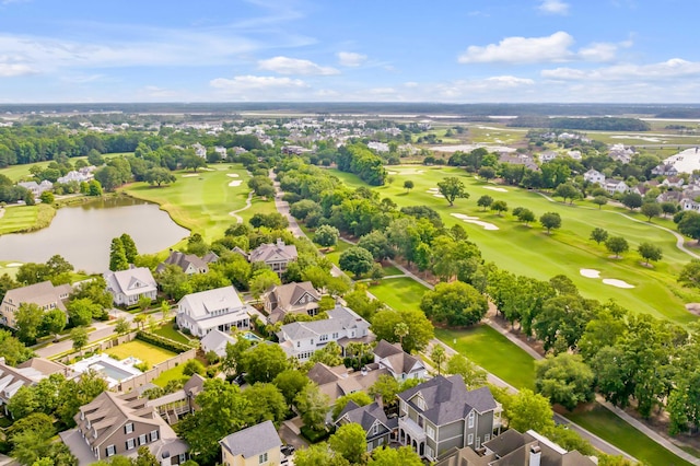 aerial view featuring golf course view, a water view, and a residential view