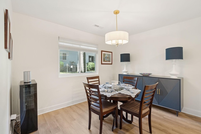 dining space with light hardwood / wood-style flooring