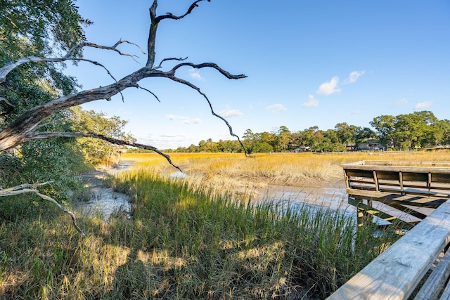 dock area featuring a water view and a rural view