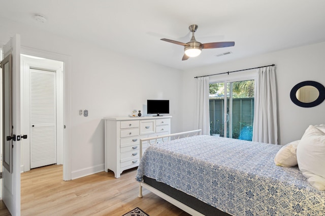 bedroom with ceiling fan and light hardwood / wood-style floors