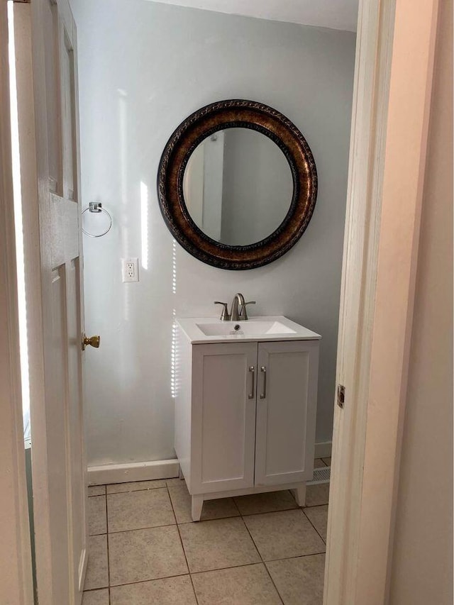 bathroom with tile patterned flooring and vanity