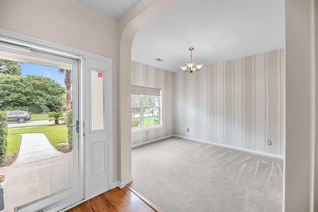 1445 Ashley Gardens Blvd, Charleston, SC 29414 - foyer entrance featuring a chandelier, baseboards, wallpapered walls, and wood finished floors