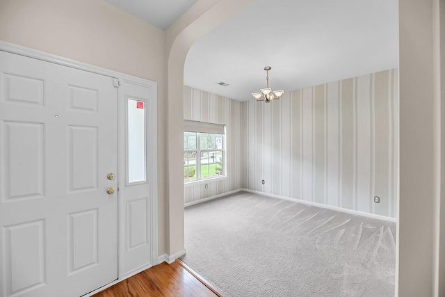 1445 Ashley Gardens Blvd, Charleston, SC 29414 - entryway featuring a chandelier, baseboards, wallpapered walls, and wood finished floors