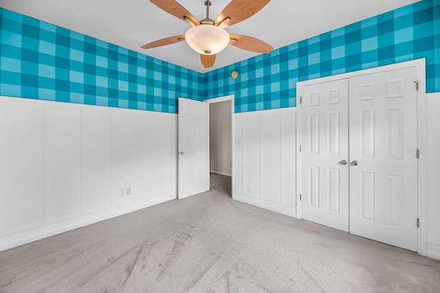 1445 Ashley Gardens Blvd, Charleston, SC 29414 - unfurnished bedroom with carpet flooring, wallpapered walls, a ceiling fan, a decorative wall, and a closet