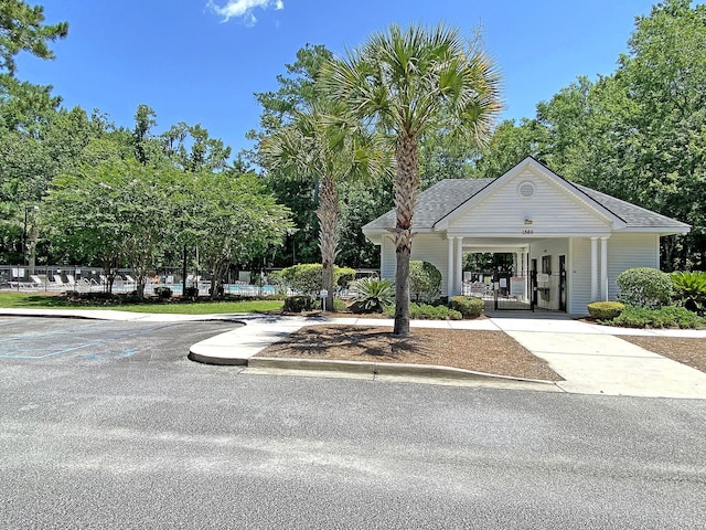1445 Ashley Gardens Blvd, Charleston, SC 29414 - view of property's community featuring concrete driveway, a gate, and view of wooded area