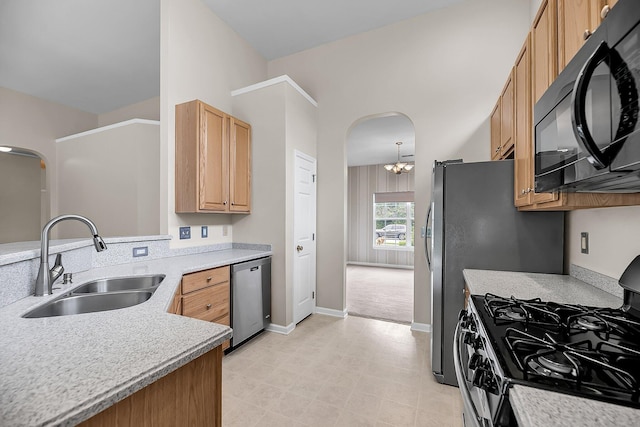 1445 Ashley Gardens Blvd, Charleston, SC 29414 - kitchen with stainless steel appliances, a sink, arched walkways, and light countertops