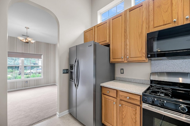 1445 Ashley Gardens Blvd, Charleston, SC 29414 - kitchen featuring stainless steel appliances, light colored carpet, plenty of natural light, and light countertops