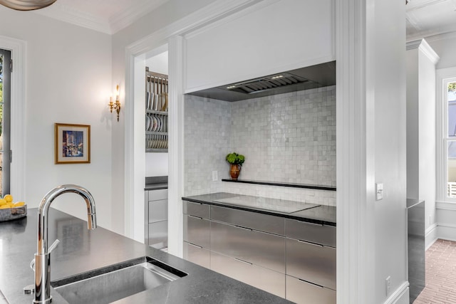 kitchen with premium range hood, black electric stovetop, sink, ornamental molding, and tasteful backsplash