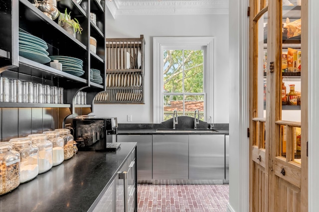 kitchen with crown molding and sink