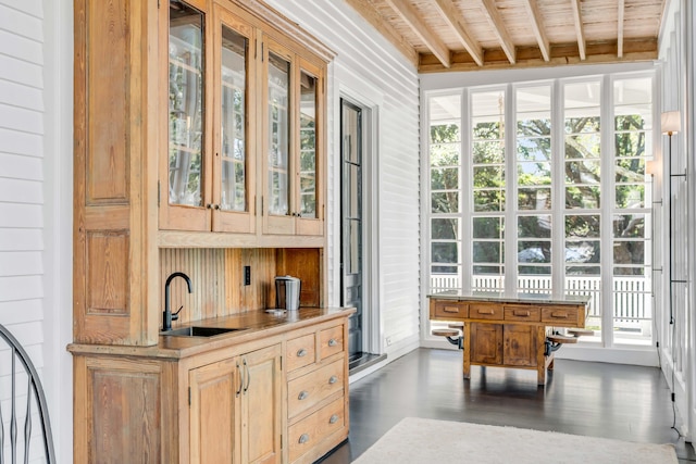 sunroom with vaulted ceiling with beams, wood ceiling, and sink