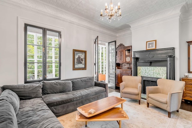 living room featuring a notable chandelier, a wealth of natural light, and french doors