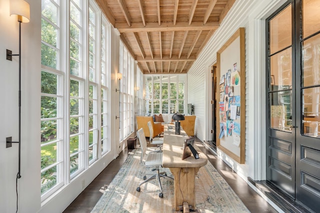 sunroom featuring beamed ceiling and wooden ceiling