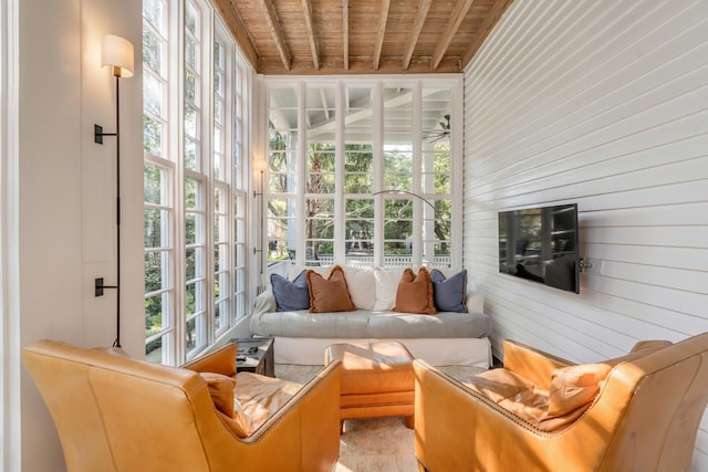 sunroom featuring beam ceiling and wood ceiling