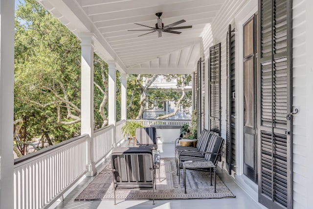 exterior space with ceiling fan and vaulted ceiling