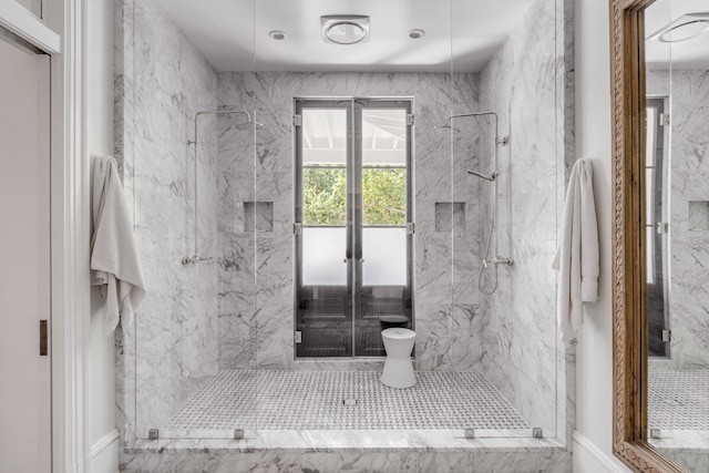 bathroom with a shower with shower door