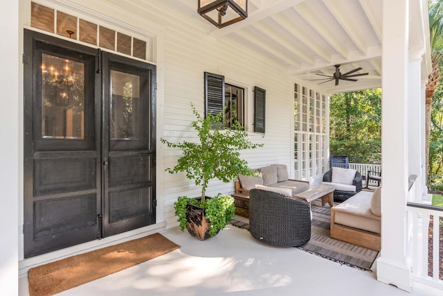 doorway to property featuring ceiling fan and covered porch