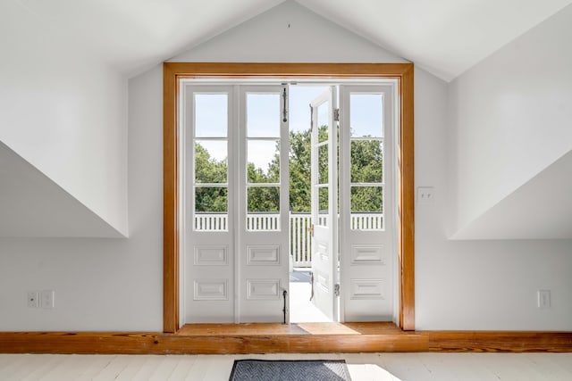 doorway featuring vaulted ceiling