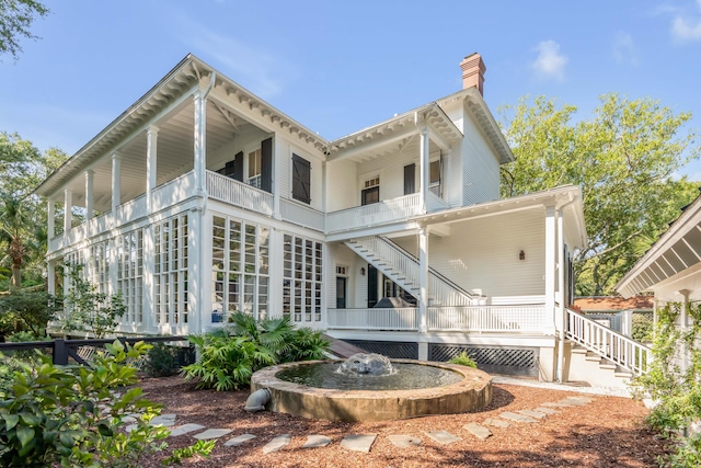 back of property featuring a balcony