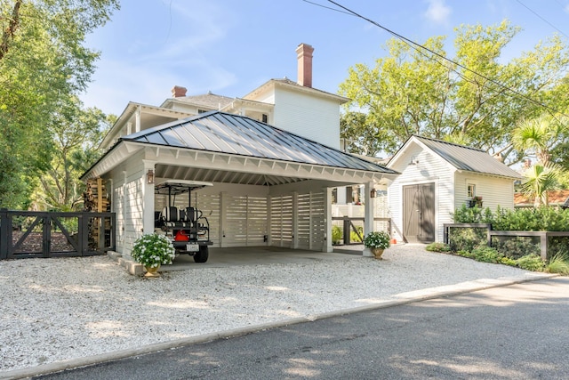 view of front of property featuring a storage unit