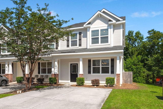 9079 Parlor Dr, Ladson, SC 29456 - craftsman house with a porch, a front lawn, and brick siding
